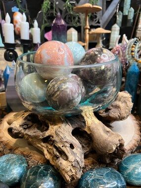 Large molten glass vase on wooden base